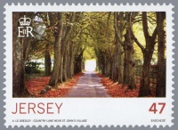 2015 stamp showing a country lane in autumn