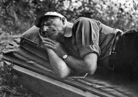 Oswald Bisson having an after-lunch nap at a family camp in 1952, at the age of 74