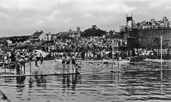 An inter-island water polo game at Havre des Pas Pool