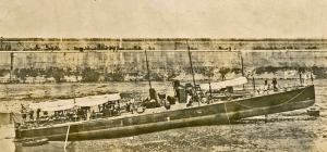 An unidentified vessel beached in the harbour in the early 20th century