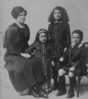 Lena Mills, nee Ogier, with her children Irene, Vera and William in 1917. Lena, from Guernsey, married George Henry Mills in 1906