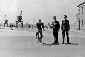 Two policemen and a German cyclist at the Weighbridge
