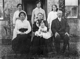 Vibert family: Clara Allo, Annie Symons, Blanche Le Marquand, Laura Ahier, Ada Vibert, Frederick Ahier and Edward Vibert at Woodlands, St Ouen in 1919