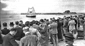 One of the Isle mailboats arriving to be greeted by a large crowd