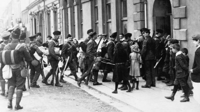 Recently mobilised militiamen of the 3rd (Town) Battalion enter newly requisitioned billets at New Street School in St Helier as curious children watch on in July or early August 1914.
