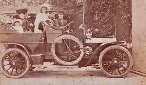 We believe that this photograph of a family in their chauffeur-driven car was taken in Jersey but we cannot be certain