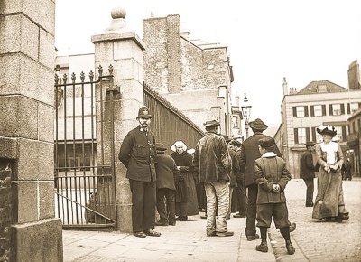 The reason for this gathering outside the gates of the former cattle market in Minden Place, and the presence of a policeman, are not known