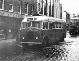 Buses negotiate a flooded York Street in the 1960s