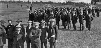 This image most likely shows recruits for the Militia’s 3rd (Town) Battalion being assembled and paraded at F.B. Fields in September 1914. Efforts were made after mobilisation at the outbreak of war to increase the number of troops available for Militia service including forcing numerous men who had avoided their legal duty before the war.