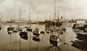 Leisure craft with mail steamers in the background