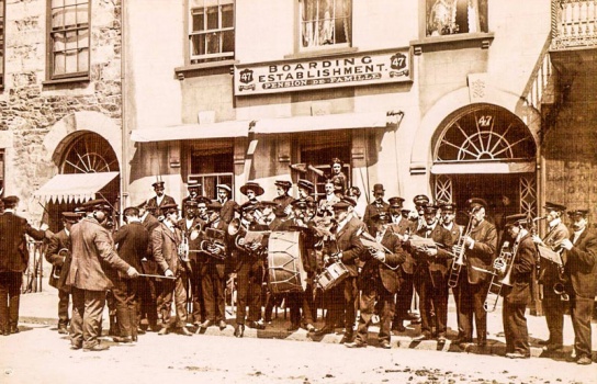 Was this a visiting band staying at No 47? We don't know when the picture was taken. The bandsmen look possibly French, so they could have been participating in one of the Concours musicale in the early 20th century]]