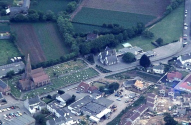 This 1977 aerial photograph shows the parish church and school, with building work on the new village development under way in the foreground