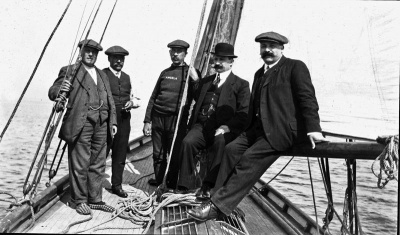 Mr Le Bourdiec (bowler hat) and crew members of his yacht