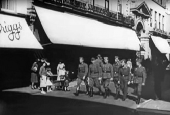 Off-duty soldiers walk along King Street