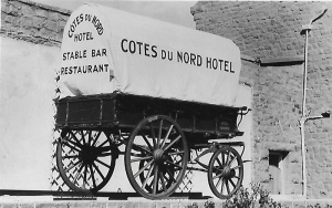 A covered wagon advertising the bar