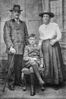 This photograph is believed to be of William and Sissy Penney with their grandson