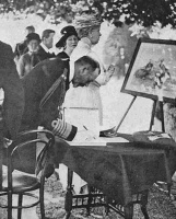 Signing the visitors' book at Mont Orgueil