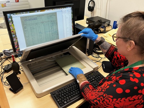 Debbie uses a flat bed scanner to digitise small documents