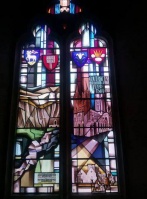A stained-glass window in the church, honouring the Coutanche family and the Normandy town of Coutances