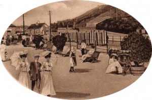 Ladies stroll along the promenade in their finery