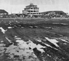 A waterlogged grass landing strip in February 1951