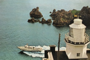 A hydrofoil passes Point Robert lighthouse