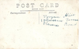 The young Vyvyan Ahier practiced writing his name on the back of a postcard