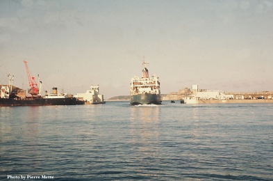 A mailboat passes through the pierheads