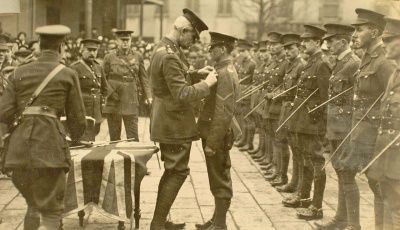 Lance Corporal Ball of the 4th Battalion South Staffordshire Regiment receives the Distinguished Conduct Medal from the Lieutenant Governor in January 1916.