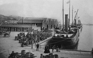 Potato barrels line the quayside