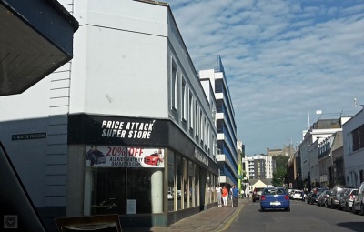 The furniture store on the corner with Rue du Funchal, once Corbins, had several owners and at least two rebuilds, before it was again demolished and rebuilt in the 2010s