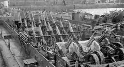 German guns are taken away to be dumped at sea