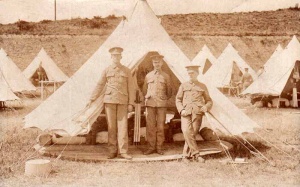 Militia troops outside their camp tent